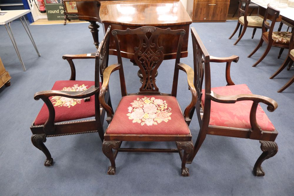 Three George III carved mahogany elbow chairs